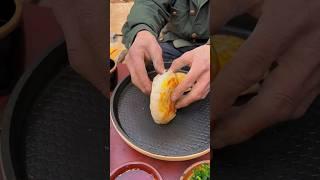 Tongguan Roujiamo Fried eggs on discus griddle